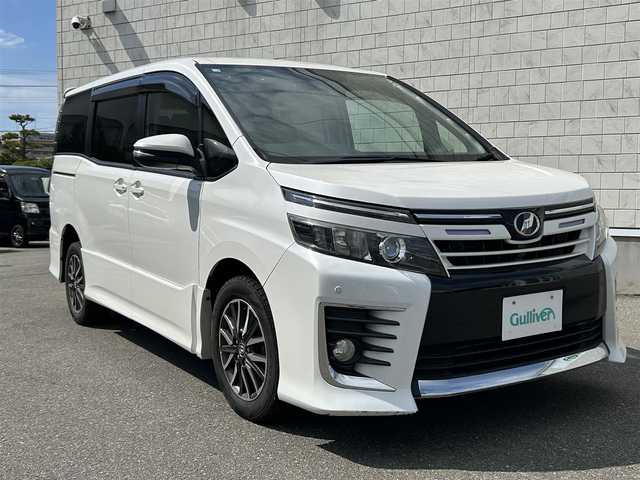 トヨタ ヴォクシー ZS 山形県 2014(平26)年 9.8万km ホワイトパールクリスタルシャイン 4WD/純正9インチナビ・フルセグTV/フリップダウンモニター/両側パワースライドドア/ビルトインET/横滑り防止機能/LEDヘッドライト/スマートキー2個/オートライト/フォグライト/純正16インチアルミホイール/スマートキー/プッシュスタート