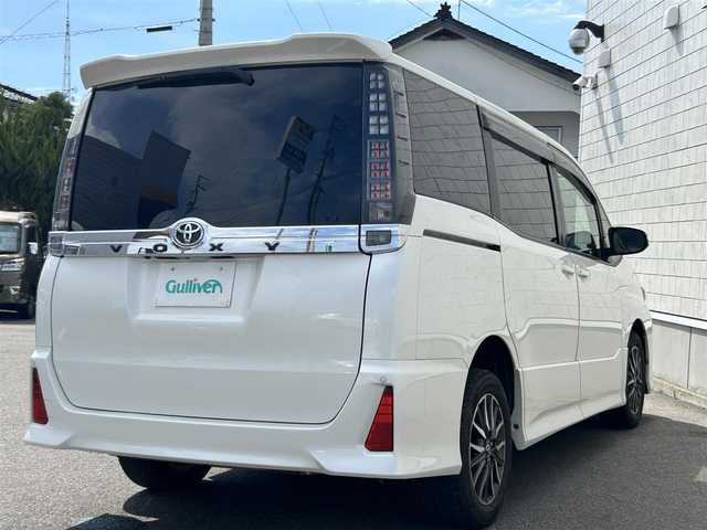 トヨタ ヴォクシー ZS 山形県 2014(平26)年 9.8万km ホワイトパールクリスタルシャイン 4WD/純正9インチナビ・フルセグTV/フリップダウンモニター/両側パワースライドドア/ビルトインET/横滑り防止機能/LEDヘッドライト/スマートキー2個/オートライト/フォグライト/純正16インチアルミホイール/スマートキー/プッシュスタート