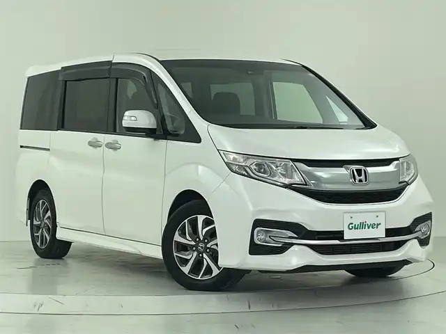 ホンダ ステップワゴン スパーダ ホンダセンシング 大阪府 2017(平29)年 6.1万km ホワイトオーキッドパール ホンダセンシング/・衝突軽減ブレーキ（CMBS）/・誤発進抑制機能/・アダプティブ・クルーズ・コントロール（ACC）/・車線維持支援システム（LKAS）/・標識認識機能/・路外逸脱抑制機能/・先行車発進お知らせ機能/純正7インチSDナビ/DVD/CD/BT/FM/AM/革巻きステアリング/両側パワースライドドア/パドルシフト/ステアリングスイッチ/アイドリングストップ/ビルトインETC