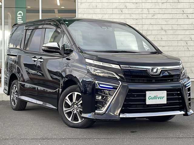 トヨタ ヴォクシー ZS 煌Ⅱ 岩手県 2019(令1)年 7.5万km ブラック 純正10インチナビ(CD/DVD/SD/ラジオ/BT)/純正フリップダウンモニター/フルセグテレビ/バックカメラ/両側パワースライドドア/プリクラッシュセーフティ/レーンディパチャーアラート/オートマチックハイビーム/クルーズコントロール/ビルトインETC/横滑り防止機能/コーナーセンサー/アイドリングストップ/プッシュスタート/スマートキー/ステアリングスイッチ/2列目サンシェード/純正16inアルミホイール/電動格納ミラー/ウィンカーミラー/ドアバイザー
