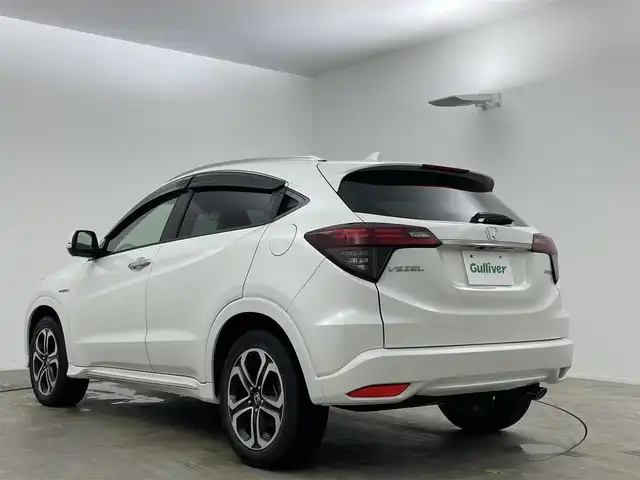 ホンダ ヴェゼル ハイブリッド Z ホンダセンシング 岡山県 2020(令2)年 5万km プラチナホワイトパール 純正8インチナビ/・バックカメラ/・FM/AM/Bluetooth/フルセグ/CD/DVD/HDMI/ホンダセンシング/・衝突軽減ブレーキ/・車線維持支援システム/・アダプティブクルーズコントロール/ハーフレザーシート/・D/Nシートヒーター/パドルシフト/ステアリングスイッチ/ISOFIX/チルトステアリング/シートリフター/ウィンカーミラー/ビルトインETC/純正17インチアルミ/純正フロアマット/LEDヘッドライト/社外ドアバイザー