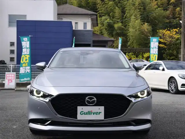 マツダ マツダ３セダン 20S プロアクティブ 熊本県 2021(令3)年 1.3万km ソニックシルバーM ワンオーナー/純正ナビ/【フルセグテレビ/Bluetooth/USB/HDMI/CD/DVD】/360°ビューモニター/クルーズコントロール/衝突被害軽減ブレーキ/レーンキープアシスト/ブラインドスポットモニター/ステアリングスイッチ/パーキングセンサー/電子パーキング/オートホールド/オートハイビーム/純正18インチアルミホイール/アイドリングストップ/横滑り防止/MTモード/パドルシフト/ウインカーミラー/取扱説明書