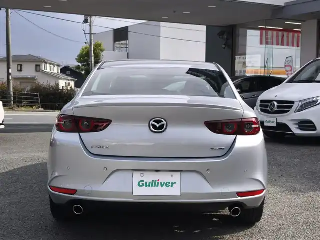 マツダ マツダ３セダン 20S プロアクティブ 熊本県 2021(令3)年 1.3万km ソニックシルバーM ワンオーナー/純正ナビ/【フルセグテレビ/Bluetooth/USB/HDMI/CD/DVD】/360°ビューモニター/クルーズコントロール/衝突被害軽減ブレーキ/レーンキープアシスト/ブラインドスポットモニター/ステアリングスイッチ/パーキングセンサー/電子パーキング/オートホールド/オートハイビーム/純正18インチアルミホイール/アイドリングストップ/横滑り防止/MTモード/パドルシフト/ウインカーミラー/取扱説明書