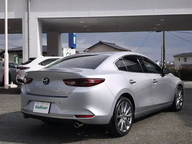 マツダ マツダ３セダン 20S プロアクティブ 熊本県 2021(令3)年 1.3万km ソニックシルバーM ワンオーナー/純正ナビ/【フルセグテレビ/Bluetooth/USB/HDMI/CD/DVD】/360°ビューモニター/クルーズコントロール/衝突被害軽減ブレーキ/レーンキープアシスト/ブラインドスポットモニター/ステアリングスイッチ/パーキングセンサー/電子パーキング/オートホールド/オートハイビーム/純正18インチアルミホイール/アイドリングストップ/横滑り防止/MTモード/パドルシフト/ウインカーミラー/取扱説明書