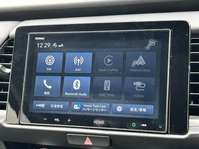 ホンダ フィット e:HEVホーム ブラックスタイル 奈良県 2024(令6)年 1.4万km プレミアムクリスタルレッドM 純正８インチディスプレイオーディオ　/ｂｌｕｅｔｏｏｔｈ　/applecaraplay/androidauto/リアワイドカメラ　/ＥＴＣ　/ハーフレザーシート　/ドライブレコーダー前後　/Hｏｎｄａｓｅｎｓｉｎｇ　/コーナーセンサー前後　/アダブティブクルーズコントロール/ブレーキホールド/LEDヘッドライト/オートライト/純正フロアマット/カーテンエアバッグ