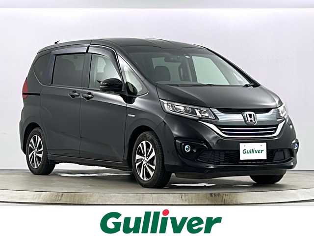 ホンダ フリード ハイブリット G ホンダセンシング 愛知県 2018(平30)年 3.8万km プレミアムスパークルブラックパール 純正7型ナビ【フルセグ　ＣＤ　ＤＶＤ　Ｂｌｕｅｔｏｏｔｈ】/フリップダウンモニター/バックカメラ　/ドライブレコーダー/両側電動スライドドア　/衝突軽減ブレーキ　/レーンキープアシスト　/レーダークルーズコントロール　/アイドリングストップ/ＬＥＤヘッドライト/オートライト/ハーフレザーシート/純正フロアマット/禁煙車