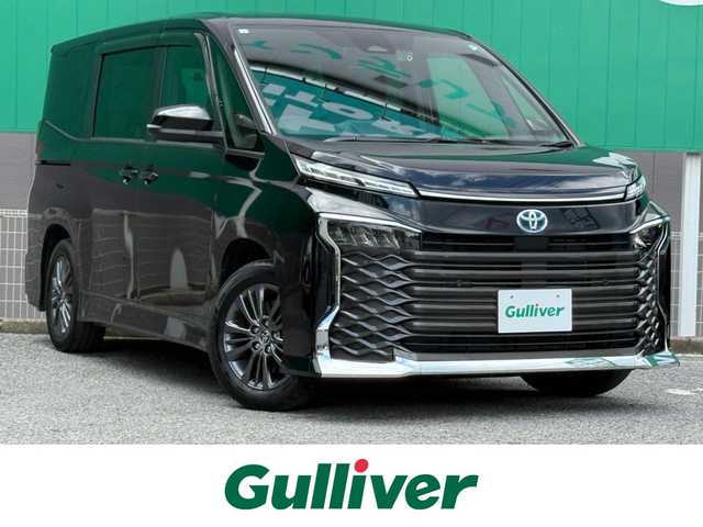 トヨタ ヴォクシー ハイブリッド S－G 千葉県 2023(令5)年 1.8万km アティチュードブラックマイカ 純正8インチディスプレイオーディオ/ETC2.0/両側パワースライド/ユニバーサルステップ/前席シートヒーター/バックカメラ/社外前後ドライブレコーダー/セーフティセンス/レーダークルーズコントロール/LEDヘッドライト