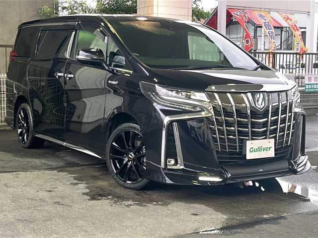 トヨタ アルファードハイブリット エグゼクティブ ラウンジ S 京都府 2019(平31)年 8.4万km スパークリングブラックパールクリスタルシャイン 純正SDナビ /フルセグTV /Bluetooth/CD/DVD/Blu-ray再生機能有/USB/AUX/JBL /純正ビルトインETC2.0/デュアルスピーカー/デュアルエアコン/TRDエアロ （フロント、リア）/BSM /ウィンカーミラー/デジタルインナーミラー/禁煙車 /両側パワースライドドア/パノラミックビューモニター/フリップダウンモニター /前後コーナーセンサー /横滑り防止装置/レーンキープアシスト/盗難防止装置/Wサイドエアバッグ/カーテンエアバッグ/衝突被害軽減ブレーキ/LEDヘッドライト/フロントフォグランプ/オートライト/オートマチックハイビーム/前席＆2列目パワーシート /D席ポジションメモリー/前席シートヒーター/エアシート/ハンドルヒーター/2列目サンシェード/ツインサンシェード/エンジンスターター付（キーレス機能有）