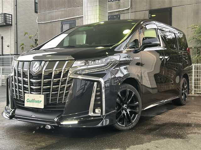 トヨタ アルファードハイブリット エグゼクティブ ラウンジ S 京都府 2019(平31)年 8.4万km スパークリングブラックパールクリスタルシャイン 純正SDナビ /フルセグTV /Bluetooth/CD/DVD/Blu-ray再生機能有/USB/AUX/JBL /純正ビルトインETC2.0/デュアルスピーカー/デュアルエアコン/TRDエアロ （フロント、リア）/BSM /ウィンカーミラー/デジタルインナーミラー/禁煙車 /両側パワースライドドア/パノラミックビューモニター/フリップダウンモニター /前後コーナーセンサー /横滑り防止装置/レーンキープアシスト/盗難防止装置/Wサイドエアバッグ/カーテンエアバッグ/衝突被害軽減ブレーキ/LEDヘッドライト/フロントフォグランプ/オートライト/オートマチックハイビーム/前席＆2列目パワーシート /D席ポジションメモリー/前席シートヒーター/エアシート/ハンドルヒーター/2列目サンシェード/ツインサンシェード/エンジンスターター付（キーレス機能有）