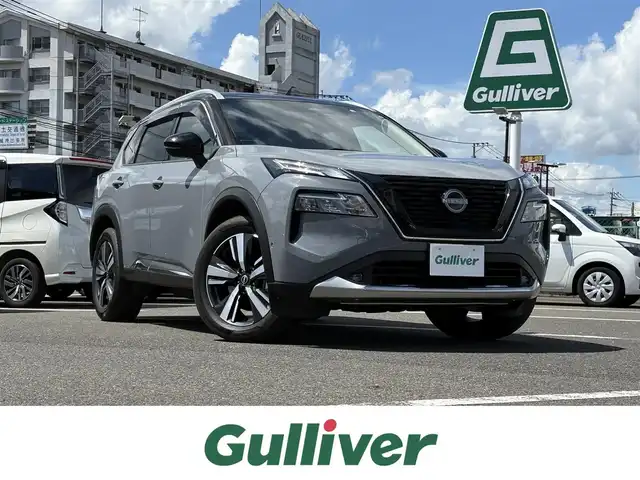 日産 エクストレイル G e－4ORCE 大分県 2022(令4)年 6万km ステルスグレー/スーパーブラック ・純正ナビ(BT/AppleCarPlay/USB)/・フルセグテレビ/・アラウンドビューモニター/・ヘッドアップディスプレイ/・プロパイロット/・駐車支援/・AC100V/・ETC 2.0/・ドライブレコーダー/・エマージェンシーブレーキ/・コーナーセンサー/・ブラインドスポットモニター/・デジタルインナーミラー/・パワーシート/・シートヒーター/・シートメモリー/・ステアリングヒーター/・オートハイビーム/・置くだけ充電/・ブレーキホールド