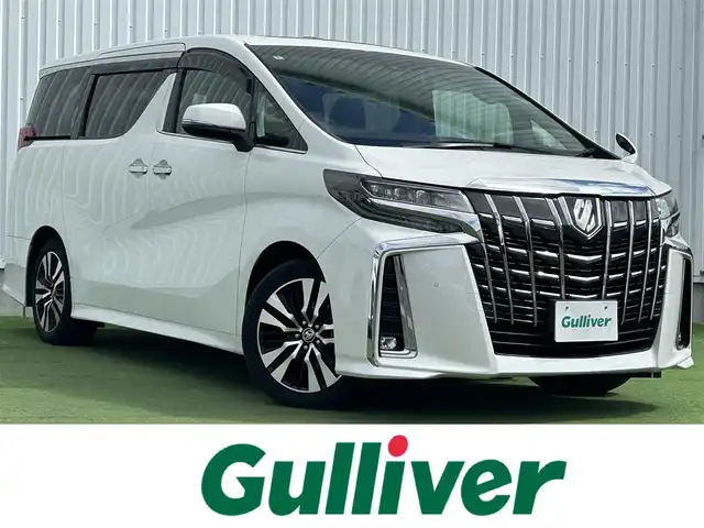 トヨタ アルファード S Cパッケージ 香川県 2020(令2)年 3.9万km ホワイトパールクリスタルシャイン 純正ディスプレイオーディオ/→AM/FM/Bluetooth/フルセグTV/フリップダウンモニター（OP）/サンルーフ（OP）/デジタルインナーミラー（MOP）/ブラインドスポットモニター/レザーシート/シートヒーター・エアシート/レーダークルーズコントロール/レーンキープアシスト/トヨタセーフティセンス/前後ドライブレコーダー/両側パワースライドドア/ビルトイン2.0ETC/コーナーセンサー/パワーバックドア/パワーシート/メモリーシート/ハンドルヒーター/ウッドコンビステアリング/ステアリングスイッチ/プッシュスタート/スマートキー/オットマン/サンシェード/純正フロアマット/純正18インチアルミホイール