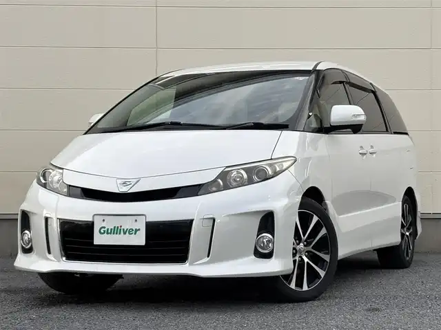 トヨタ エスティマ アエラス 茨城県 2012(平24)年 7.4万km ホワイトパールクリスタルシャイン 純正ナビ(NHZN-X62G)/(FM/AM/Bluetooth/TV/CD/DVD)/バックカメラ/フリップダウンモニター/両側パワースライドドア/クルーズコントロール/ETC/オットマン(2列目)/ドライブレコーダー(前後)/スペアキー/オートライト/純正AW