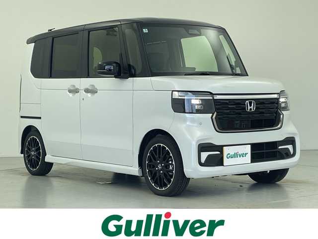 ホンダ Ｎ ＢＯＸ カスタム ターボ コーディネートS 愛知県 2025(令7)年 0.1千km プラチナホワイトパール 届出済未使用車/登録時76キロ/純正9型ナビ/・フルセグTV/・CD・DVD/・Bluetooth/ステアリングスイッチ/バックカメラ/前席シートヒーター/両側電動スライドドア/純正フロアマット/コーナーセンサー/純正LEDヘッドライト/ホンダセンシング/・衝突軽減ブレーキ（CTBS/・先行車発信お知らせ/・路外逸脱抑制機能/・標識認識機能/・渋滞追従機能付きアダプティブクルーズコントロール/・車線維持支援システム（LKAS/・誤発進・誤後退抑制機能/・近距離衝突軽減ブレーキ/・急アクセル抑制機能/・オートハイビーム