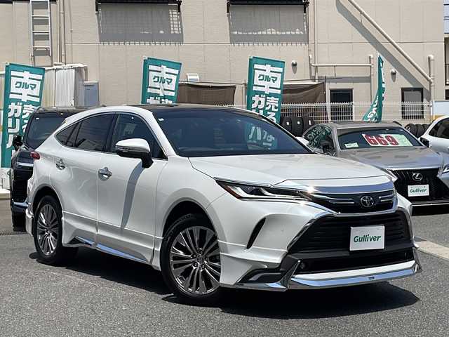 トヨタ ハリアー Z レザーパッケージ 愛知県 2024(令6)年 0.3万km プラチナホワイトパールマイカ /禁煙車//ワンオーナー//メーカーナビ//フルセグ/BT/USB/FM/AM/Miracast//TVキャンセラー//JBLプレミアムサウンド//パノラミックビューモニタ//パノラマルーフ//パワーバックドア//モデリスタエアロ//バックドアエアロプレート//バックドアガーニッシュ//フードガーニッシュ//フロントグリルガーニッシュ//シグネチャーイルミグリル//デジタルインナーミラー//純正19AW//PCS/LTA/RSA/AHB/ACC//RCTA/PKSB/BSM/HUD//先行車発進告知//後退速度抑制//LEDオートライト/フォグ//オートリトラウィンカーミラー//前席パワーシート//シートメモリ//前席シートヒーター//前席エアーシート//ランバーサポート//黒革シート//本革巻ステアリング//ステアリングスイッチ//電動パーキング//オートホールド//MTモード付AT//プッシュスタート//DRIVE MODE/NORMAL/ECO/SPORT//nanox//横滑り防止//スペアタイヤ//置くだけ充電//新車時保証書//取扱説明書/マルチメディア取説//スマートキー//スマートスペアキー