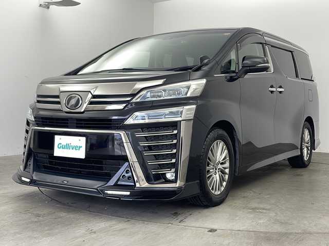 トヨタ ヴェルファイア Z Gエディション 兵庫県 2018(平30)年 6.7万km ブラック ・アルパイン11インチナビ（EX11Z）/　CD/DVD再生/　USB接続/　ipod接続/　HDMI接続/　Bluetoothオーディオ/　フルセグテレビ/・バックカメラ/・ビルドインETC/・Toyota Safety Sense/　プリクラッシュセーフティ/　レーンディパーチャーアラート/　オートマチックハイビーム/・先行車発進告知機能/・パーキングサポートブレーキ（前後方静止物）/・車両接近通報装置/・ABS/・横滑り防止機能/・前後コーナーセンサー/・盗難防止装置/・オートライト/・LEDヘッドライト/・W＋サイドエアバック/・カーテンエアバック/・三列シート/・オットマン/・電動リアゲート/・前後ドライブレコーダー/・ウォークスルー/・純正フロアマット/・パワーシート（（運転席・助手席・2列目）/・メモリーシート（運転席）/・レザーシート/・エアシート（運転席・助手席）/・シートヒーター（運転席・助手席）/・ステアリングヒーター/・両側パワースライドドア/・TRDエアロパーツ（フロント）/・純正17インチアルミホイール/・WACエアコン/・スマートキー/・スペアキー