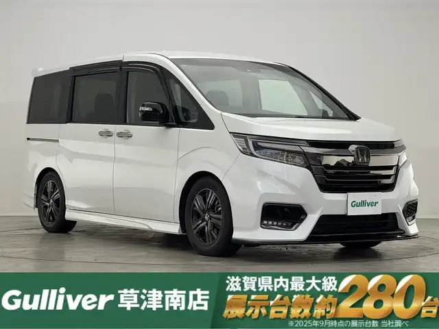ホンダ ステップワゴン 滋賀県 2020(令2)年 6万km プラチナホワイトパール 純正10インチナビ/【Bluetooth/CD/DVD/フルセグTV/USB/HDMI】/純正フリップダウンモニター/ホンダセンシング/・衝突軽減ブレーキ〈CMBS〉/・誤発進抑制機能/・歩行者事故低減ステアリング/・路外逸脱抑制機能/・渋滞追従機能付アダプティブクルーズコントロール/・LKAS〈車線維持支援システム〉/・先行車発進お知らせ機能/・標識認識機能/両側パワースライドドア/ハーフレザーシート/D/Nシートヒーター/LEDヘッドライト/ビルトインETC2.0/電動パーキングブレーキ/オートブレーキホールド/プッシュスタート/スマートキー/ステアリングリモコン