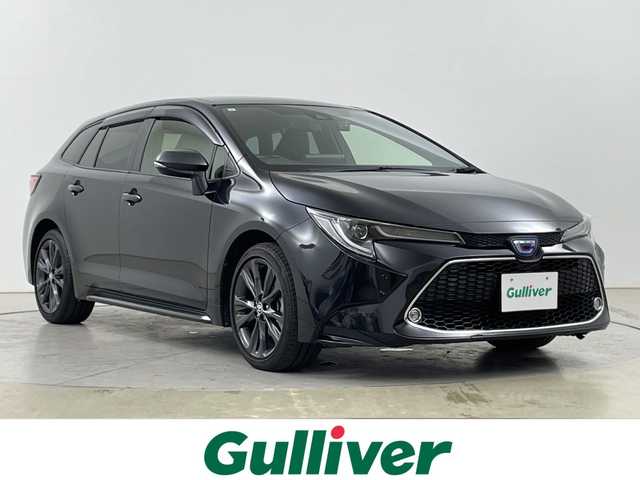 トヨタ カローラツーリング ハイブリッド ダブルバイビー 道央・札幌 2021(令3)年 2.4万km ブラックマイカ ・４WD/ハイブリット/寒冷地仕様/・トヨタセーフティセンス/・レーダークルーズコントロール/・プリクラッシュセーフティ/・ブラインドスポットモニター/・純正9インチディスプレイオーディオ/・Bluetooth.miracast.フルセグ/・バックカメラ /・LEDオートライト/オートハイビーム/・前後ドライブレコーダー/・フロントワイパーデアイサー/・ハーフレザーシート/シートヒーター/・ステアリングヒーター・ミラーヒーター/・エンジンスターター/・ビルトインETC/AC100V