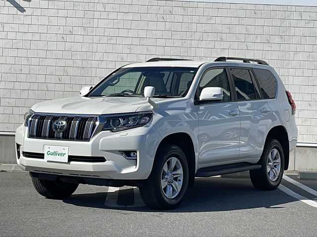 トヨタ ランドクルーザー プラド TX Lパッケージ 山形県 2017(平29)年 5.9万km ホワイトパールクリスタルシャイン 禁煙車/ワンオーナー/Toyota　Safety Sense　P/・プリクラッシュセーフティシステム/・レーンディパーチャーアラート/・オートマチックハイビーム/・レーダークルーズコントロール/ベージュ革シート/純正9インチナビ(AM/FM/BT/CD/DVD)/フルセグTV/TVキャンセラー/バックカメラ/パワーシート(D＋N＋3列目)/シートヒーター(D＋N席)/デュアルエアコン/ルーフレール/ヘッドライトウォッシャー/スペアタイヤ/フォグランプ/ETC/純正AW/スマートキー/プッシュスタート