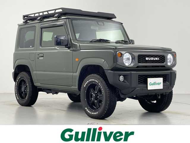 スズキ ジムニー XL 愛知県 2023(令5)年 1.5万km ジャングルグリーン 5速MT/リフトアップサスペンション/カロッツェリアナビ/・Bluetooth/フルセグTV/ＭＩＤ１６インチアルミホイール/純正オプションレトログリル　　/前席シートヒーター　/ルーフラック　/ＬＥＤヘッドライト　/ミラーヒーター　/純正フロアマット/レーンキープアシスト/ダウンヒルアシストコントロール/プッシュスタート