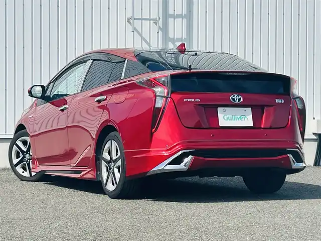 トヨタ プリウス A ツーリングセレクション 熊本県 2016(平28)年 13.6万km エモーショナルレッド 純正SDメモリナビ（DSZT-YC4T）/AM/FM/CD/DVD/HDMI/Bluetooth)/フルセグTV　/バックカメラ/ビルトインETC/ドライブレコーダー（前後）/トヨタセーフティセンス/・プリクラッシュセーフティ/・クリアランスソナー/・インテリジェントクリアランスソナー/・オートハイビーム/ブラインドスポットモニター/ヘッドアップディスプレイ/パーキングアシスト/横滑り防止装置/クルーズコントロール（追従あり）/モデリスタエアロ（フロント・サイド・リア）/合皮シート/・シートヒーター（D/N)/電子パーキング/プッシュスタート/・スマートキー/LEDヘッドライト/・オートライト/・フォグランプ/純正革巻きステアリング/・ステアリングスイッチ/純正ドアバイザー/純正フロアマット/電動格納ミラー/・ウィンカーミラー