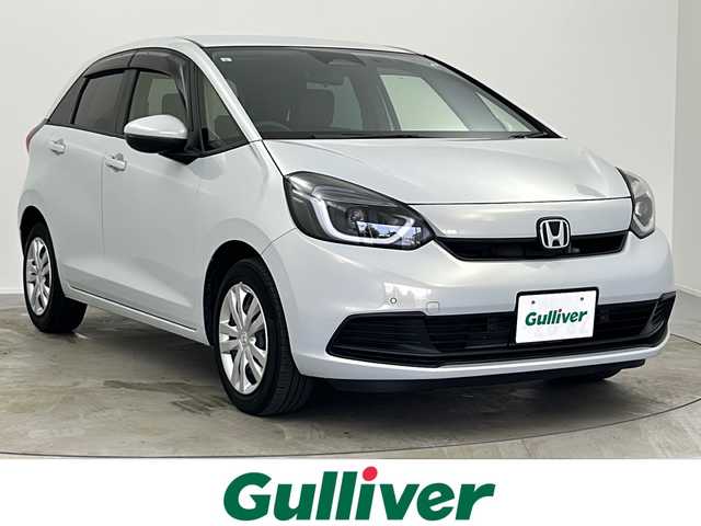 ホンダ フィット e:HEVベーシック 大阪府 2023(令5)年 6.8万km プレミアムサンライトホワイトパール ホンダセンシング/純正ＧＡＴＨＥＲＳナビ/・CD/Bluetooth/USB/バックカメラ/ETC/LEDヘッドライト/スマートキー/プッシュスタート/クルーズコントロール追従有/オートライト/オートマチックハイビーム/純正フロアマット/衝突被害軽減システム/レーンキープアシスト