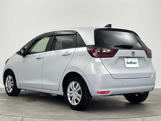 ホンダ フィット e:HEVベーシック 大阪府 2023(令5)年 6.8万km プレミアムサンライトホワイトパール ホンダセンシング/純正ＧＡＴＨＥＲＳナビ/・CD/Bluetooth/USB/バックカメラ/ETC/LEDヘッドライト/スマートキー/プッシュスタート/クルーズコントロール追従有/オートライト/オートマチックハイビーム/純正フロアマット/衝突被害軽減システム/レーンキープアシスト
