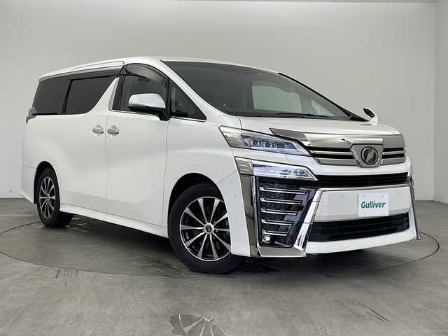 トヨタ ヴェルファイア ZG 兵庫県 2018(平30)年 13.9万km ホワイトパールクリスタルシャイン ・純正SDナビ/　Bluetoothオーディオ　/　CD/DVD再生/　SDミュージックサーバー/　フルセグテレビ/・バックカメラ/・ビルドインETC2.0/・フリップダウンモニター/・Toyota Safety Sense/　プリクラッシュセーフティ/　レーンディパーチャーアラート/　オートマチックハイビーム/・先行車発進告知機能/・パーキングサポートブレーキ（前後方静止物）/・車両接近通報装置/・レザーシート/・シートヒーター/・エアシート