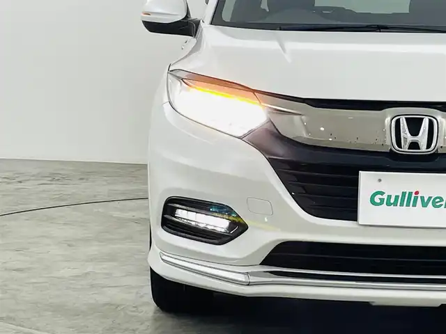 ホンダ ヴェゼル ハイブリッド Z ホンダセンシング 福島県 2019(平31)年 7.1万km プラチナホワイトパール ホンダセンシング/・CMBS/・ACC/・先行車発進告知/・路外逸脱抑制/・レーンアシスト/・リアアクティブフォースペダル/・標識認機能/４ＷＤ　/純正メモリナビゲーション/【AM/FM/DVD/CD/Bluetooth/フルセグ/HDMI】　/型番:VXM-187VFI/ＥＴＣ/ドライブレコーダー　/ハーフレザーシート　/電子パーキング　/・ブレーキホールド　/シートヒーター　/エンジンスターター　/・プッシュスタート　/・スマートキー/LEDライト/・オートライト/・フォグライト/純正フロアマット/ドアバイザー/電動格納ウィンカーミラー/パドルシフト/取扱説明書/・保証書
