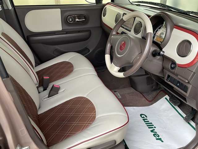 スズキ ラパン ショコラ X 福島県 2014(平26)年 6.8万km シャンパンピンクPM ワンオーナー　純正メモリナビ(ワンセグTV/CD/DVD/SD/AM/FM)　レザーシート　革巻きステアリング　アイドリングストップ　ＩＳＯＦＩＸ　オートライト　ドアバイザー　電動格納ミラー  ウィンカーミラー ＨＩＤヘッドライト　スマートキー　スペアキー×１　取扱説明書　保証書