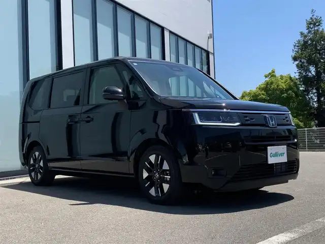 ホンダ ステップワゴン eHEV エアー 大阪府 2025(令7)年 0.1万km未満 クリスタルブラックパール 衝突軽減/両側パワースライドドア/レーダークルーズコントロール/ステアリングスイッチ/コーナーセンサー/横滑り防止装置/純正アルミホイール/プッシュスタート/スマートキー/ＵＳＢ/ＬＥＤライト
