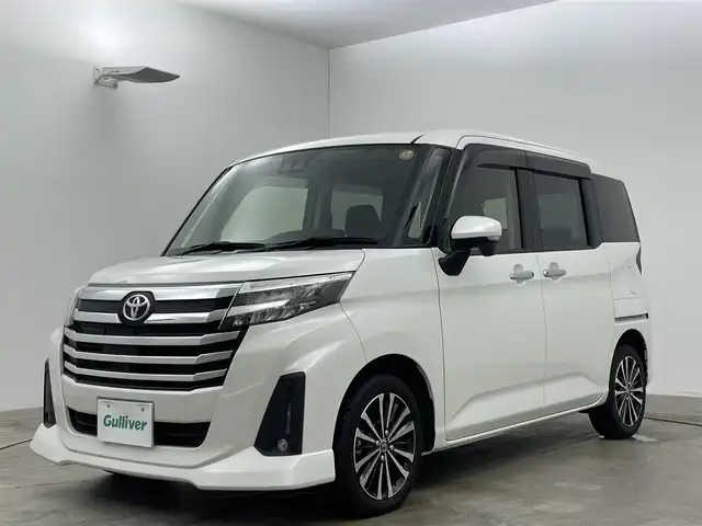 トヨタ ルーミー カスタムG－T 岡山県 2023(令5)年 3.6万km パールホワイトⅢ ワンオーナー		/純正９インチナビ/【ナビ/フルセグ/Bluetooth/DVD/】	/パノラミックビューモニター/追従型クルーズコントロール	/オートハイビーム	/LEDヘッドライト（AUTO機能付き）	/ビルトインETC	/前席シートヒーター	/運転席パワーシート	/衝突軽減ブレーキシステム	/車線逸脱防止システム	/横滑り防止装置	/踏み間違い防止装置/純正15インチアルミ	/コーナーセンサー（前後）	/純正フロアマット	/ステアリングスイッチ	/ISOFIX/チルトステアリング/シートリフター/シートバックテーブル/ウィンカーミラー/ドアバイザー	/プッシュスタート	/取扱説明書	/新車保証書/スペアキー×１