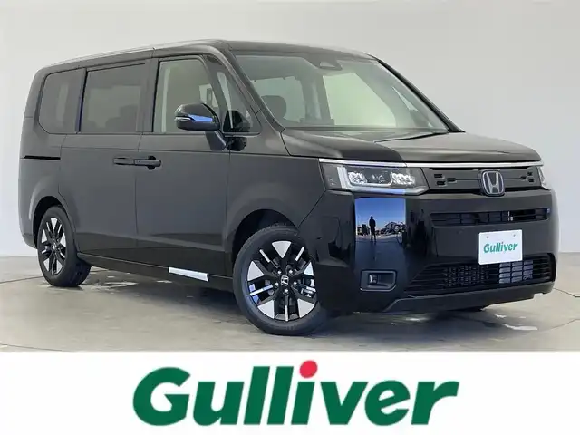 ホンダ ステップワゴン eHEV エアー EX 富山県 2025(令7)年 0.1千km クリスタルブラックパール 登録済未使用車/11.4インチ純正ナビ【LXM-247VFLi】/（AMFM/CD/DVD/USB/SD/BT/CarPlay）/フルセグTV/15.6インチ リア席モニター【VM-231FE】/バックカメラ/両側パワースライドドア/電動リアゲート/衝突被害軽減ブレーキ/アダプティブクルーズコントロール/レーンキープアシスト/コーナーセンサー前後/オートマチックハイビーム/前席シートヒーター/パドルシフト/スマートキー×２/プッシュスタート/取扱説明書/保証書