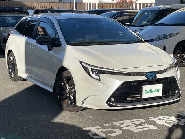 トヨタ カローラツーリング ハイブリッド ダブルバイビー 福岡県 2023(令5)年 3万km プラチナホワイトパールマイカ 純正ナビ/Bluetooth/TVフルセグ/ETC2.0/Wi-Fi/ドラレコ/オートライト/ステアリングヒーター/横滑り/フォグランプ/クルーズコントロール/ハンズフリー/電動格納ミラー/シートヒーター（D・N)/DRIVEMODE/純正フロアマット/保証書/取扱説明書/スペアキー×１