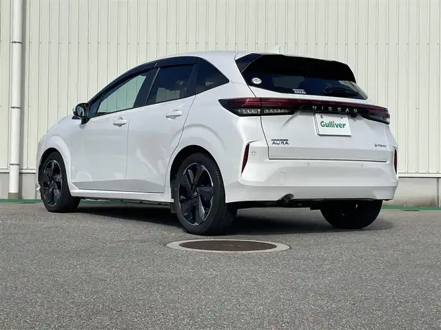 日産 オーラ 富山県 2023(令5)年 8.3万km ピュアホワイトパール アラウンドビューモニター／/純正８インチナビ／/フルセグＴＶ／/Ｂｌｕｅｔｏｏｔｈ／/プロパイロット／/ＢＯＳＥサウンド／/シートヒーター／/ステアリングヒーター／/ビルトインＥＴＣ２．０／/置くだけ充電／/純正ドラレコ/LEDオートライト/ステアスイッチ