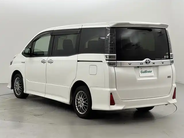 トヨタ ヴォクシー ハイブリッド ZS 煌 福岡県 2019(平31)年 4.4万km ホワイトパールクリスタルシャイン 後席モニター　/純正１０型ナビ　/バックカメラ　/両側パワースライドドア　/ＥＴＣ　/前後ドライブレコーダー　/クルーズコントロール　/衝突軽減　/レーンキープ　/コーナーセンサー　/シートヒーター　/純正ＡＷ　/ＬＥＤ