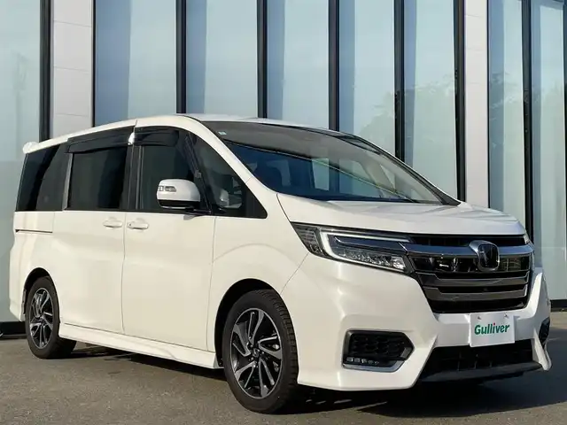 ホンダ ステップワゴン スパーダ クルスピセンシング 大阪府 2020(令2)年 4.6万km パール 純正１０インチナビ　/   フルセグＴＶ/ＥＴＣ２．０/フリップダウンモニター　/全方位モニター/前後ドライブレコーダー/追従走行有りクルーズコントロール/両側パワースライドドア/電動格納サードシート/シートヒーター/エアシート/ターボ   /エアロパーツ/LED /純正フロアマット/ホンダセンシング/横滑り防止装置/レーンキープアシスト/衝突軽減システム/盗難防止装置/カーテンエアバック/スマートキー/アイドリングストップ