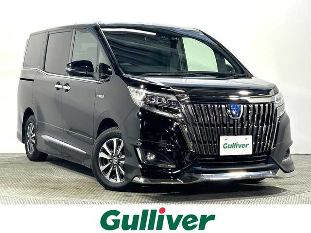 トヨタ エスクァイア ハイブリッド Gi プレミアムパッケージ ブラックテーラード 大阪府 2019(平31)年 1.2万km ブラック モデリスタエアロ 純正10incナビ(フルセグ/DVD再生/Bluetooth) バックカメラ ETC 両側パワースライドドア ハーフレザー シートヒーター 衝突軽減 クルコン トヨタセーフティセンス