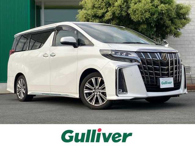 トヨタ アルファード S タイプゴールド 静岡県 2020(令2)年 5.8万km ホワイトパールクリスタルシャイン エンジンスタートボタン/保証書/取扱説明書/パワーステアリング/パワーウィンドウ/スマートキー/Wオートエアコン/スペアキー１本/クルーズコントロール/フリップダウンモニター/USB入力端子/ETC/バックカメラ/純正9インチSDナビ（BT/フルセグ）/三列シート/ドライブレコーダー前後/ウォークスルー/純正フロアマット/ハーフレザー/両側パワースライドドア/純正18インチアルミホイール/社外19インチアルミホイール（サマータイヤ）トランク内有/ABS/横滑り防止装置/コーナーセンサー前後/レーンキープアシスト/盗難防止装置/オートライト/オートマチックハイビーム/三眼LEDヘッドライト/Wプラスサイドエアバック/衝突軽減システム/カーテンエアバック/BSM(ブラインドスポットモニター)