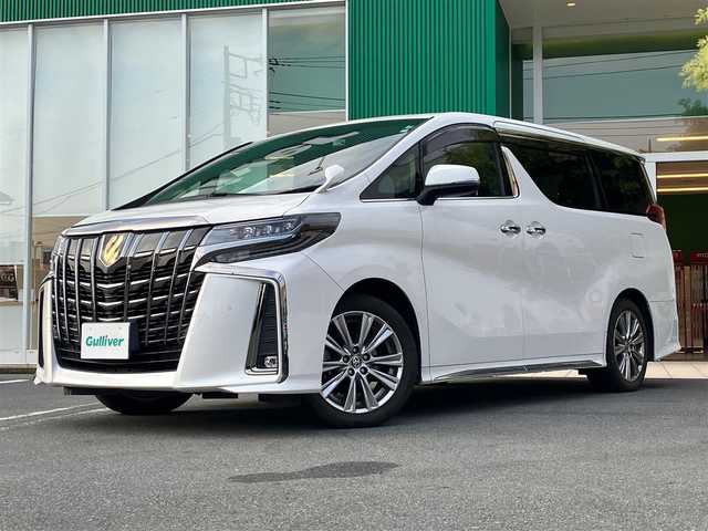 トヨタ アルファード S タイプゴールド 静岡県 2020(令2)年 5.8万km ホワイトパールクリスタルシャイン エンジンスタートボタン/保証書/取扱説明書/パワーステアリング/パワーウィンドウ/スマートキー/Wオートエアコン/スペアキー１本/クルーズコントロール/フリップダウンモニター/USB入力端子/ETC/バックカメラ/純正9インチSDナビ（BT/フルセグ）/三列シート/ドライブレコーダー前後/ウォークスルー/純正フロアマット/ハーフレザー/両側パワースライドドア/純正18インチアルミホイール/社外19インチアルミホイール（サマータイヤ）トランク内有/ABS/横滑り防止装置/コーナーセンサー前後/レーンキープアシスト/盗難防止装置/オートライト/オートマチックハイビーム/三眼LEDヘッドライト/Wプラスサイドエアバック/衝突軽減システム/カーテンエアバック/BSM(ブラインドスポットモニター)