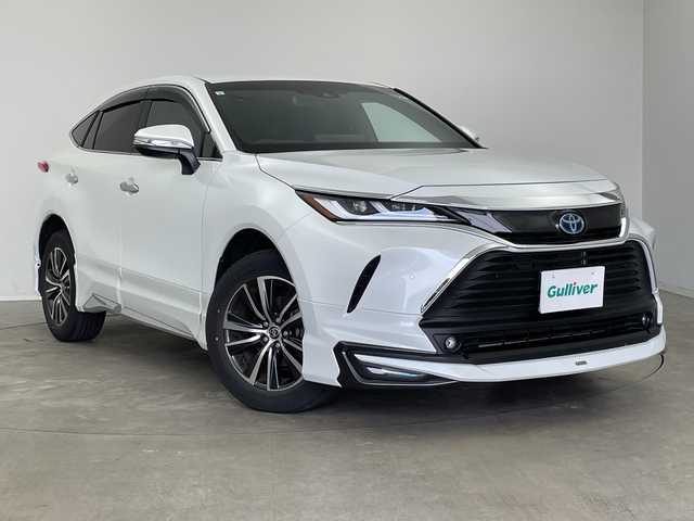 トヨタ ハリアー ハイブリッド G 新潟県 2023(令5)年 1.3万km プラチナホワイトパールマイカ 純正メモリナビ/（BT/FM/AM/フルセグ）/モデリスタエアロ/バックカメラ/ステアリングスイッチ/ハーフレザーシート/デジタルインナーミラー/電動リアゲート/AC100V/純正LEDオートヘッドライト/テレビキャンセラー/ワイパーデアイサー/ウィンカーミラー/電格ミラー/フロントフォグライト/ETC2.0/取扱説明書/保証書