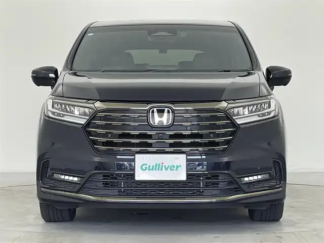 ホンダ オデッセイ ハイブリッド e:HEVアブソルート EXブラックED 群馬県 2023(令5)年 1.3万km プレミアムヴィーナスブラックP 純正15.6インチフリップダウンモニター/＝＝＝＝＝/純正11.インチナビ/・AM/FM/CD/DVD/SD/Bluetooth/・USB/HDMI/AppleCarPlay/AndroidAuto/マルチビューカメラシステム/ホンダセンシング/・衝突軽減ブレーキ/近距離衝突軽減ブレーキ/・先行車発進お知らせ機能/・歩行者事故低減ステアリング/・路外逸脱抑制機能/・渋滞追従機能付アダプティブクルーズコントロール/・車線維持支援システム/・ブラインドスポットインフォメーション/・オートハイビーム/・標識認識機能/・誤発進抑制機能/後方誤発進抑制機能/・急アクセル抑制機能/後退出庫サポート/・パーキングセンサーシステム/両側パワースライドドア/ハンズフリーアクセスパワーテールゲート(予約ロック付)/本革シート/2列目両側アームレスト付4ウェイパワーシート(リクライニング/オットマン)/ひし2列目シートセンターテーブル(折りたたみ式・ドリンクホルダー付)/運転席8ウェイ 助手席4ウェイ パワーシート/運転席＆助手席シートヒーター＋2列目シートヒーター/18インチアルミホイール(マットベルリナブラック)