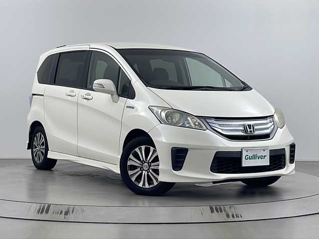 ホンダ フリード ハイブリット ジャストセレクション 埼玉県 2011(平23)年 7.3万km プレミアムホワイトパール 純正ナビ/バックカメラ/ビルトインＥＴＣ/クルーズコントロール/両側パワースライドドア/純正１５インチアルミホイール/純正フロアマット/キセノンライト/オートライト/スマートキー/Ｗエアバック