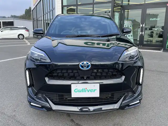 トヨタ ヤリスクロス ハイブリッド Z 愛媛県 2024(令6)年 1.4万km ブラックマイカ モデリスタエアロ/ディスプレイオーディオ/（AppleCarPlay/AndroidAuto）/アラウンドビューモニター　/レーダークルーズコントロール　/シートヒーター　/ステアリングヒーター　/衝突軽減システム　/LEDヘッドライト/オートハイビーム　/ブレーキホールド/前後コーナーセンサー/横滑り防止装置/レーンキープアシスト/盗難防止装置/純正18インチAW/スマートキー/USB・TypeC入力端子/ドライブ&EVモード選択