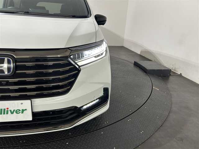 ホンダ オデッセイ ハイブリッド e:HEVアブソルート EXブラックED 三重県 2023(令5)年 0.2万km プラチナホワイトパール 純正１１インチナビ/CD/DVD/BT/MSV/フルセグTV/HDMI/マルチビューカメラ　/両側パワースライドドア　/本革シート　/オットマン　/シートヒーター　/ワイヤレス充電　/ＬＥＤヘッドライト/レーダークルーズコントロール/パワーバックドア/BSM/クリアランスソナー/スペアキー有り