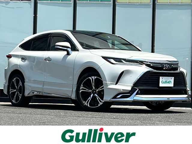 トヨタ ハリアー Z レザーパッケージ 山形県 2020(令2)年 5.1万km ホワイトパールクリスタルシャイン ４WD/純正ナビ/（AM/FM/フルセグ/BT）/モデリスタエアロ（グランブレイズスタイル）/・フロントスポイラー/・サイドスカート/・リヤスタイリングキット（リアスカート＆マフラーカッター）/20インチモデリスタホイール（245/45/20）/JBLプレミアムサウンド/調光パノラマルーフ/本革シート/シートヒーター/エアシート/ステアリングスイッチ/ステアリングヒーター/トヨタセーフティセンス/・全車速追従機能付きクルーズコントロール/・プリクラッシュセーフティー/・レーントレーシングアシスト/・アダプティブハイビームシステム/・ロードサインアシスト/・ドライバー異常時対応システム/・プロアクティブドライビングアシスト/・発進遅れ告知機能/サポカーS/パノラミックビューモニター/ブラインドスポットモニター/デジタルインナーミラー/カラーヘッドアップディスプレイ/オートブレーキホールド/電動パーキング/メモリ付きパワーシート/イルミネーテッドエントリーシステム（ドア解除で室内点灯）/ナノイーX/