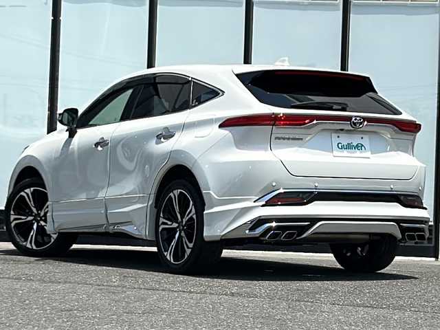 トヨタ ハリアー Z レザーパッケージ 山形県 2020(令2)年 5.1万km ホワイトパールクリスタルシャイン ４WD/純正ナビ/（AM/FM/フルセグ/BT）/モデリスタエアロ（グランブレイズスタイル）/・フロントスポイラー/・サイドスカート/・リヤスタイリングキット（リアスカート＆マフラーカッター）/20インチモデリスタホイール（245/45/20）/JBLプレミアムサウンド/調光パノラマルーフ/本革シート/シートヒーター/エアシート/ステアリングスイッチ/ステアリングヒーター/トヨタセーフティセンス/・全車速追従機能付きクルーズコントロール/・プリクラッシュセーフティー/・レーントレーシングアシスト/・アダプティブハイビームシステム/・ロードサインアシスト/・ドライバー異常時対応システム/・プロアクティブドライビングアシスト/・発進遅れ告知機能/サポカーS/パノラミックビューモニター/ブラインドスポットモニター/デジタルインナーミラー/カラーヘッドアップディスプレイ/オートブレーキホールド/電動パーキング/メモリ付きパワーシート/イルミネーテッドエントリーシステム（ドア解除で室内点灯）/ナノイーX/