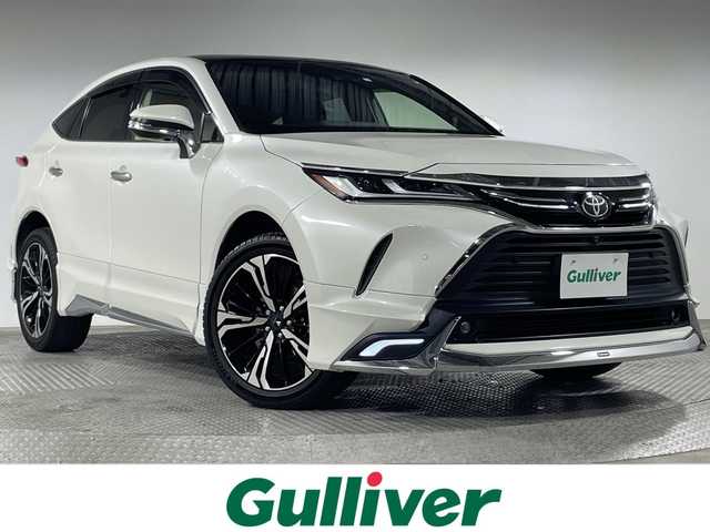トヨタ ハリアー Z レザーパッケージ 神奈川県 2020(令2)年 5.1万km ホワイトパールクリスタルシャイン 4WD/調光パノラマルーフ/モデリスタエアロ【グランブレイズスタイル】【フロント/サイド/リアアンダー】/モデリスタ20インチアルミホイール/JBLプレミアムサウンドシステム/12.3型ディスプレイオーディオ/Tコネクトナビ/フルセグ　AM FM USB　Bluetooth　AUX/パノラミックビューモニター/デジタルインナーミラー/カラーヘッドアップディスプレイ/パワーバックドア/トヨタセーフティセンス/全車速追従機能付きクルーズコントロール/プリクラッシュセーフティー/レーントレーシングアシスト/アダプティブハイビームシステム/プロアクティブドライビングアシスト/ロードサインアシスト/ドライバー異常時対応システム/発進遅れ告知機能/ブラインドスポットモニター/リヤシートマインダー/フロントリアパーキングセンサー/本革シート/前席シートヒーター/パワーシート/運転席ポジションメモリー/革巻きステアリング/ステアリングヒーター/オートブレーキホールド/電動パーキング/プッシュスタート/スマートキー/LEDヘッドランプ/オートライト/純正リアスポイラー