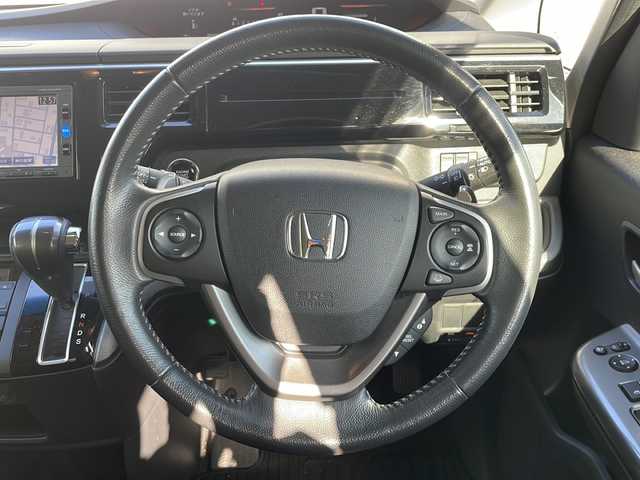 ホンダ ステップワゴン スパーダ ホンダセンシング 福井県 2016(平28)年 5.5万km モダンスティールM 登録時走行距離５４６０５ｋｍ/ワンオーナー/ターボ/ナビ装着スペシャルパッケージ/コンフォートビューパッケージ/純正メモリナビゲーション/（CD/DVD/BT）/フルセグテレビ/バックカメラ/ホンダセンシング/レーンキープアシスト/両側電動スライドドア/アダプティブクルーズコントロール/パドルシフト/ETC（ビルトイン）/純正16インチアルミホイール/LEDヘッドライト/フォグランプ/わくわくゲート/ステアリングリモコン/オートライト/プッシュスタート/スマートキー/保証書/取扱説明書