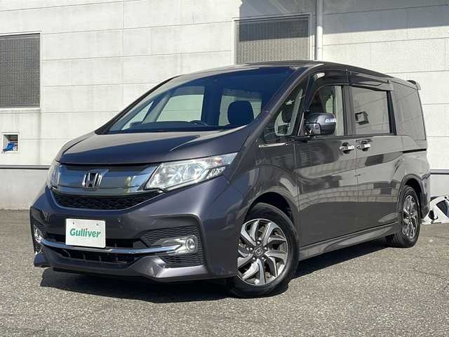 ホンダ ステップワゴン スパーダ ホンダセンシング 福井県 2016(平28)年 5.5万km モダンスティールM 登録時走行距離５４６０５ｋｍ/ワンオーナー/ターボ/ナビ装着スペシャルパッケージ/コンフォートビューパッケージ/純正メモリナビゲーション/（CD/DVD/BT）/フルセグテレビ/バックカメラ/ホンダセンシング/レーンキープアシスト/両側電動スライドドア/アダプティブクルーズコントロール/パドルシフト/ETC（ビルトイン）/純正16インチアルミホイール/LEDヘッドライト/フォグランプ/わくわくゲート/ステアリングリモコン/オートライト/プッシュスタート/スマートキー/保証書/取扱説明書