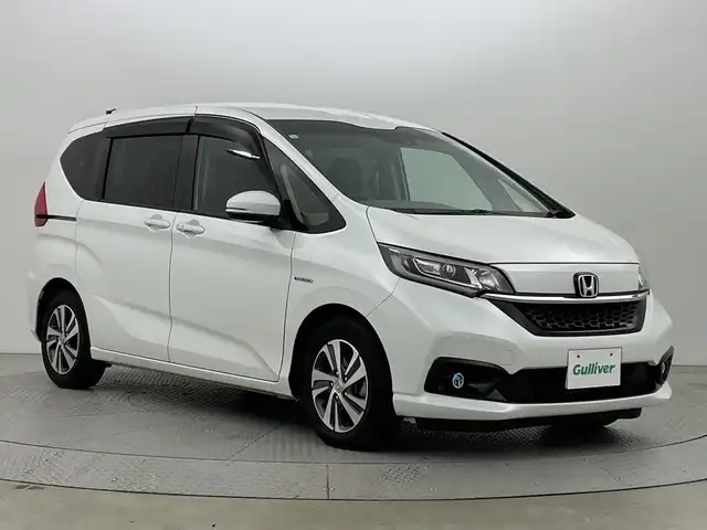 ホンダ フリード ハイブリット G ホンダセンシング 新潟県 2020(令2)年 3.9万km プラチナホワイトパール ワンオーナー　/バックモニター　/フルセグＴＶ(走行中視聴可能)　/メモリナビ(AM/FM/CD/DVD/BT)　/Ｂｌｕｅｔｏｏｔｈ接続　/ＡＷ付きスタッドレスタイヤ/ステアリングスイッチ　/両側パワースライドドア　/運転席助手席シートヒーター　/追従型クルーズコントロール　/保証書/取扱説明書/記録簿